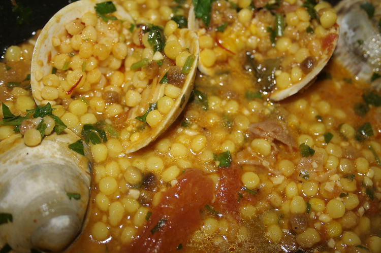 Fregola with clams, a typical Sardinian dish
